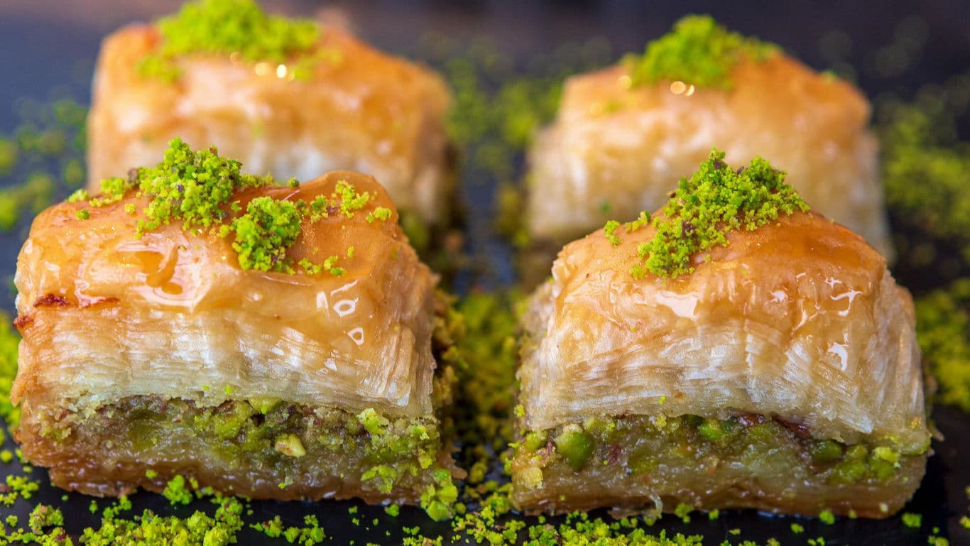 Close-up of pistachio baklava pieces with syrup glaze