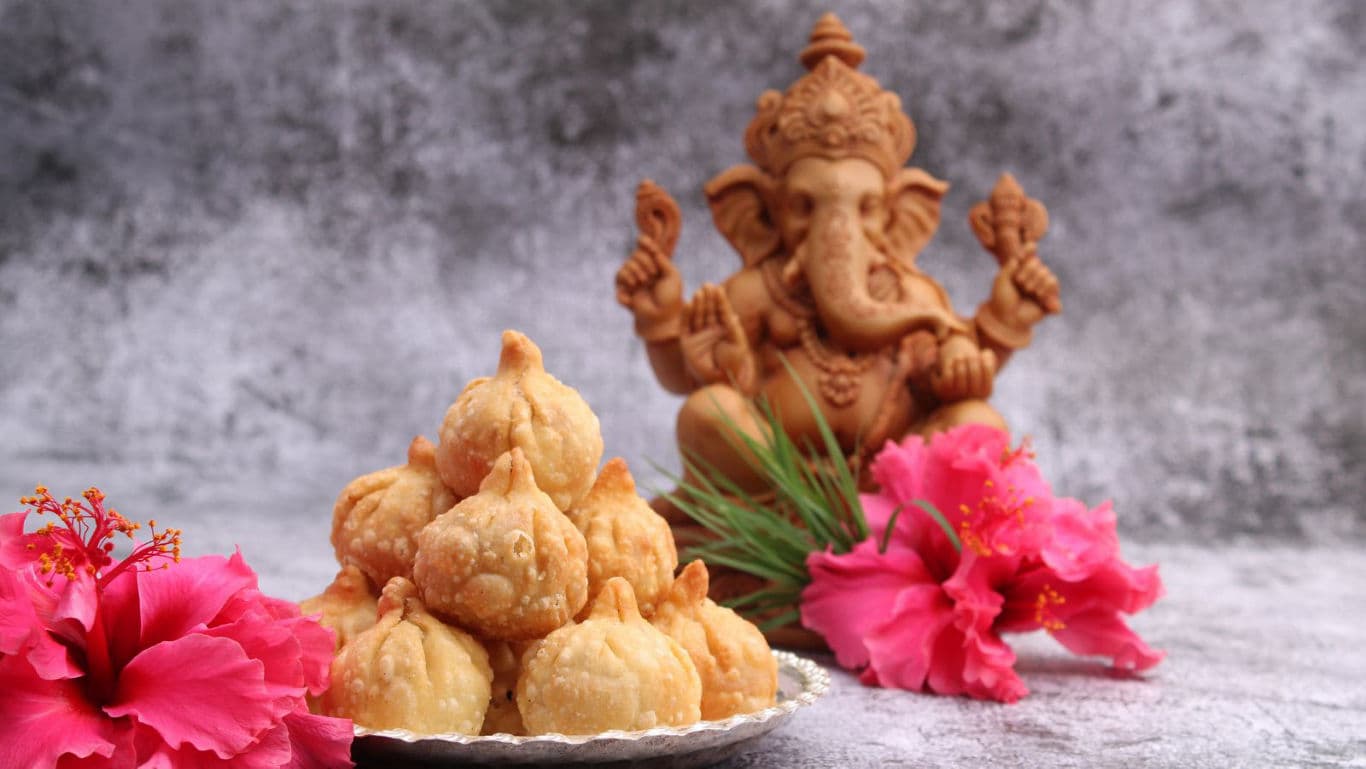 Ganesh idol with modaks.