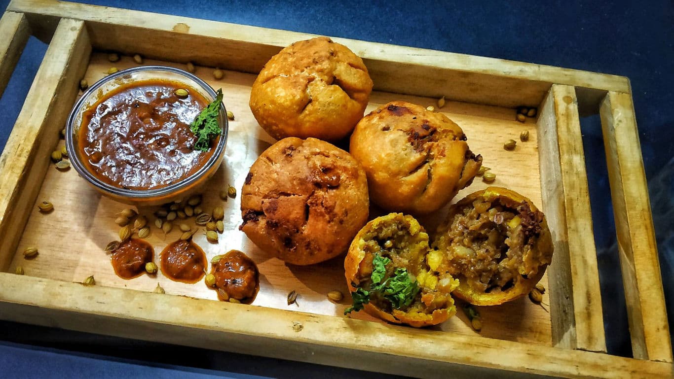 Indian stuffed fried snacks with chutney