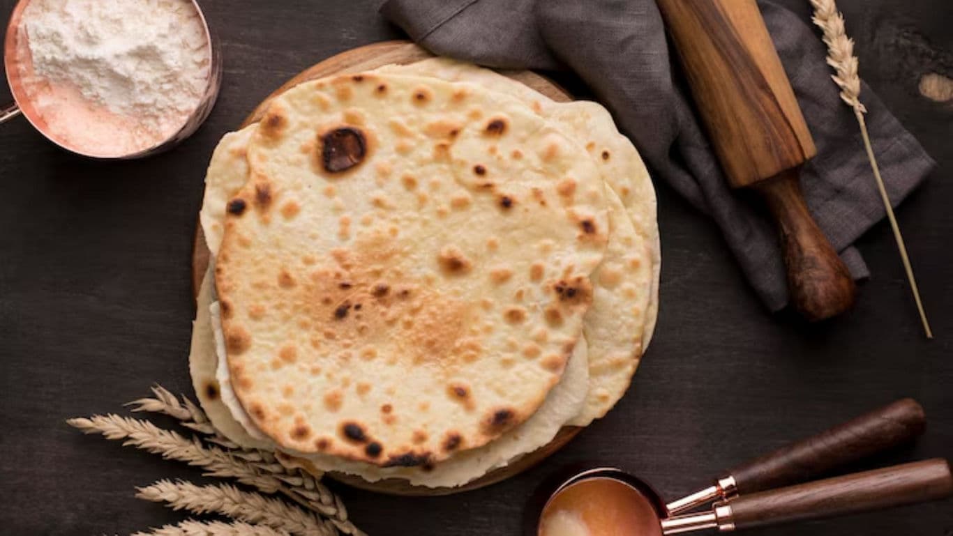Stack of homemade flatbreads on wooden board