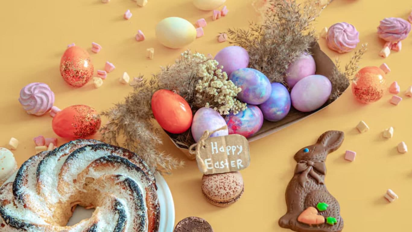 Colorful Easter Eggs and Sweets on Pastel Table