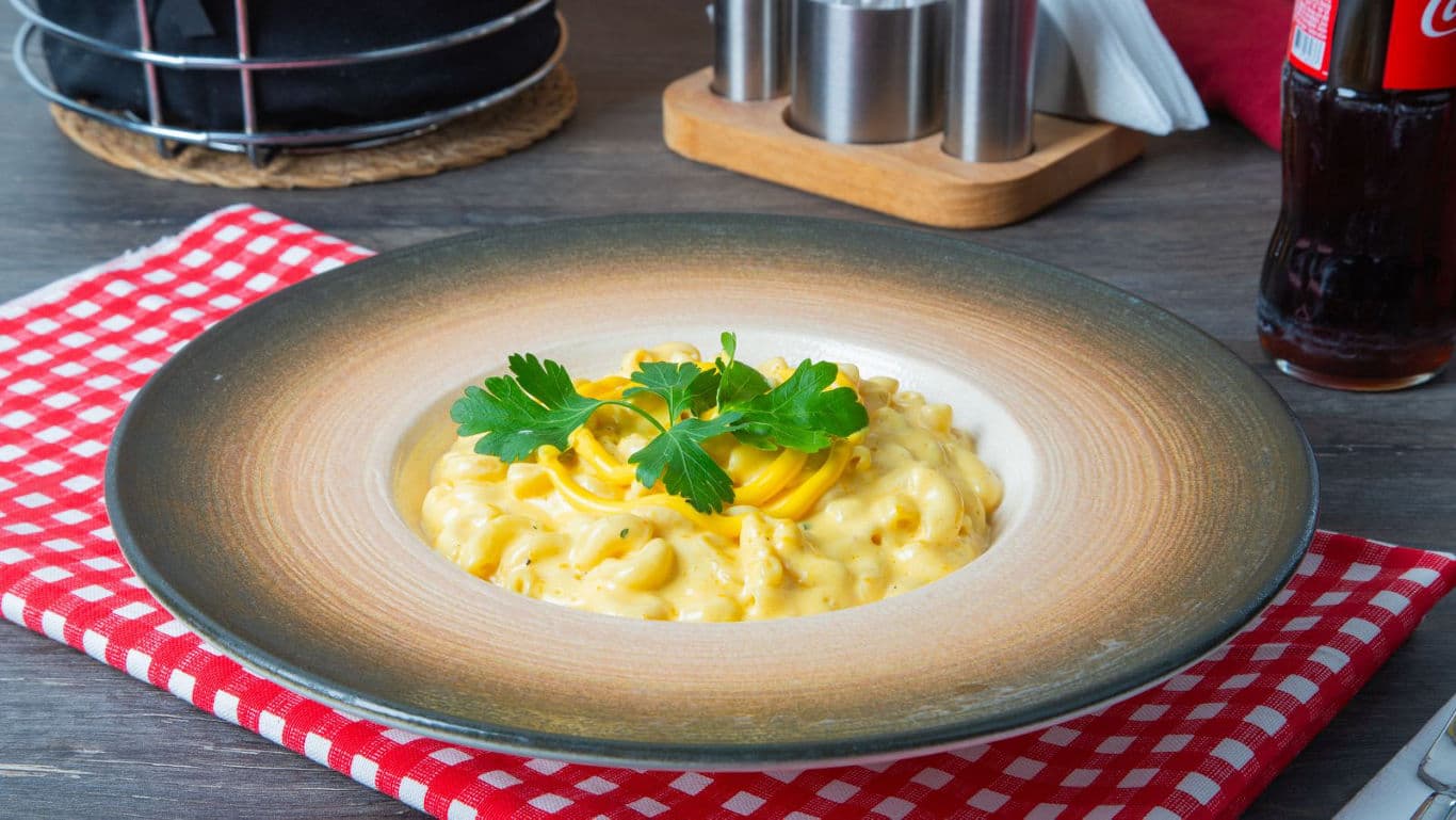 Creamy macaroni and cheese in rustic bowl