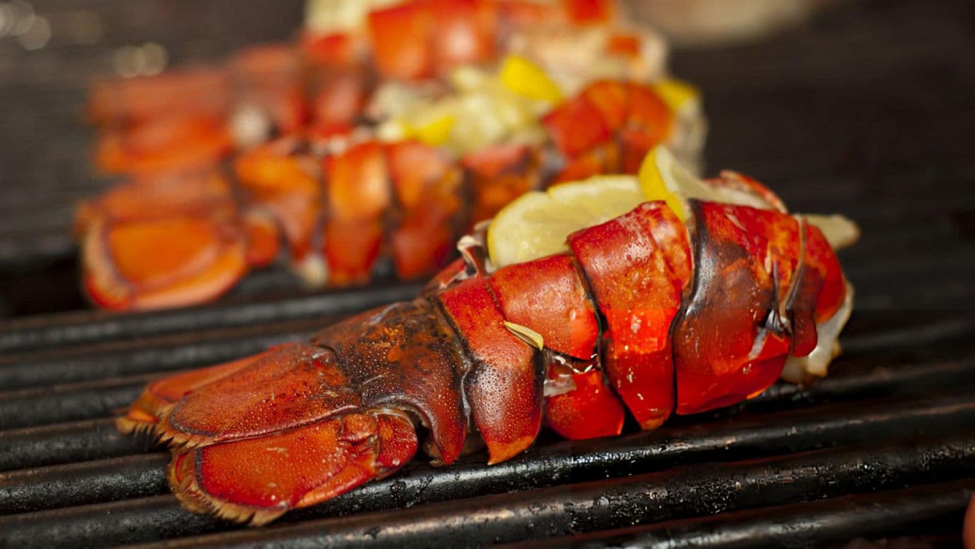 Grilled Lobster Tails with Lemon on Barbecue Grill