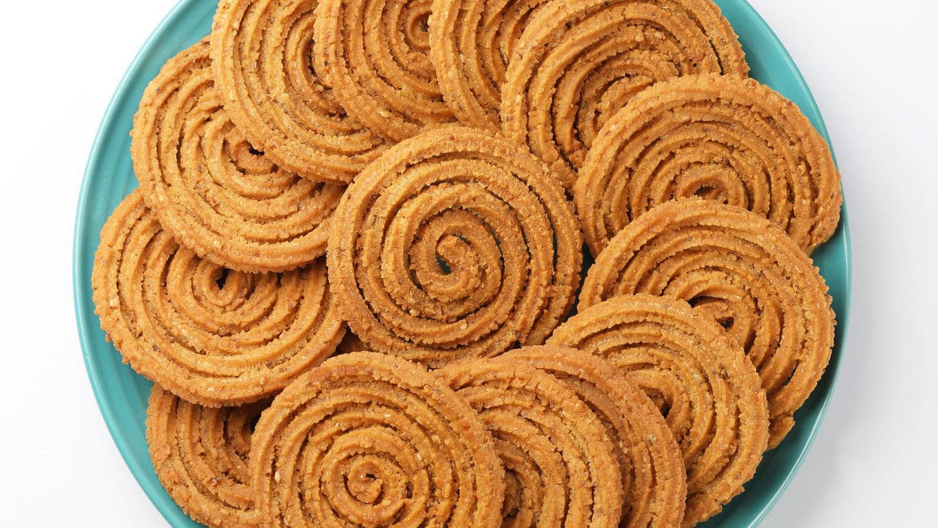 Spiral Indian snacks arranged on plate