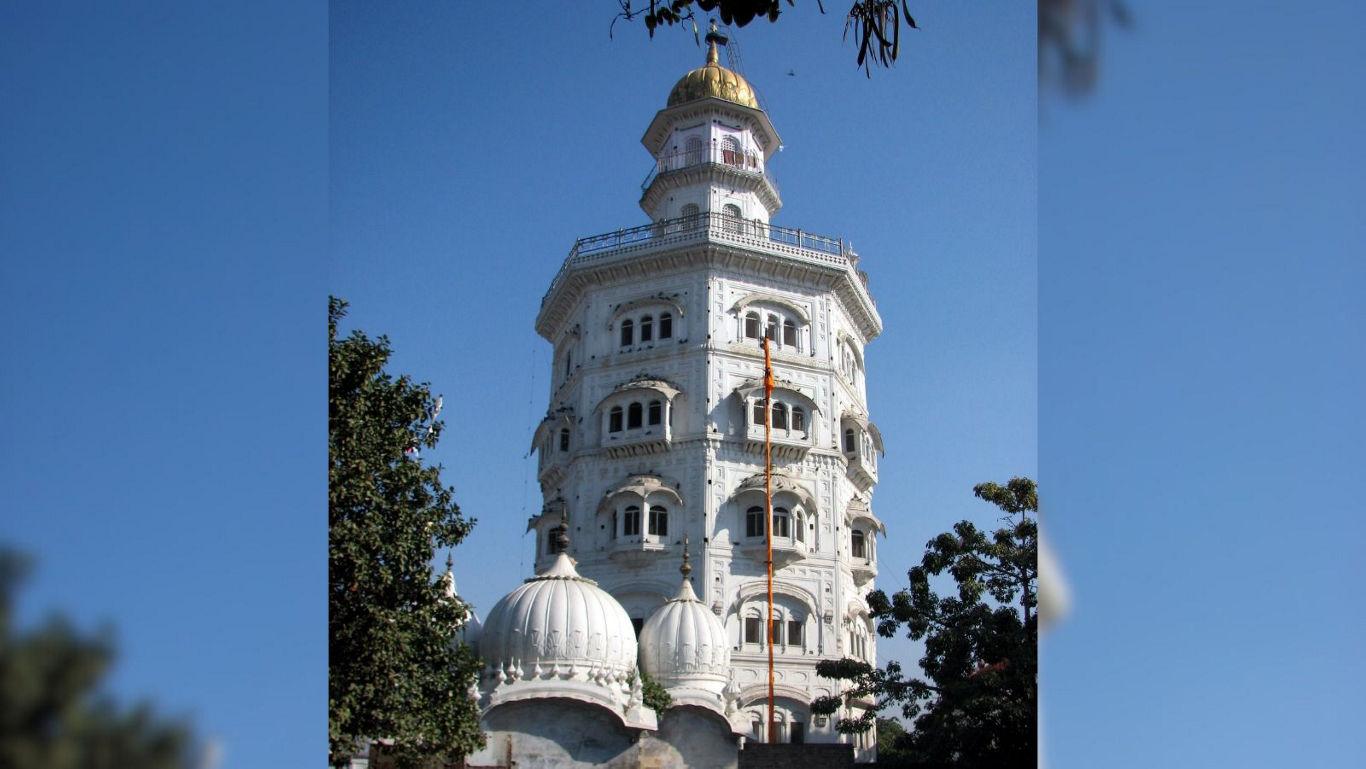 Historic white tower with golden dome