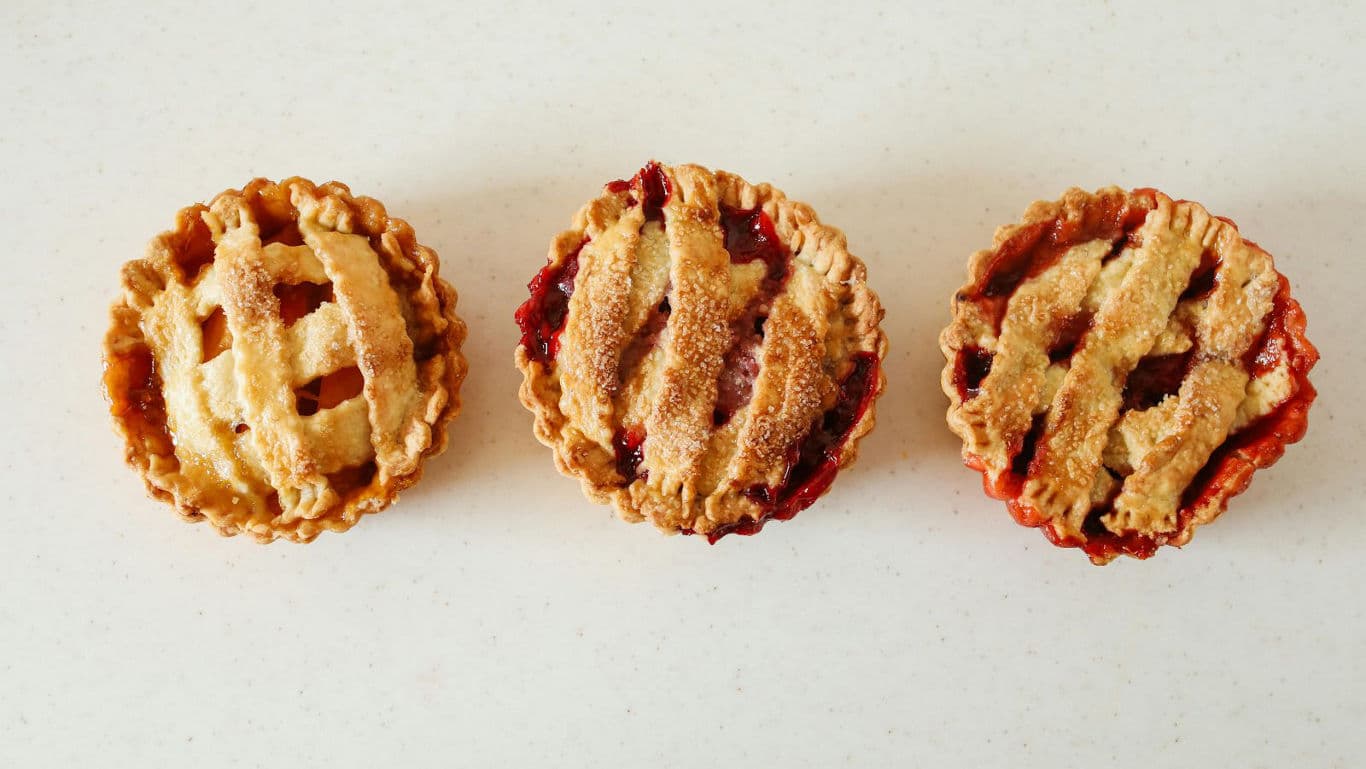 Three lattice topped mini fruit pies