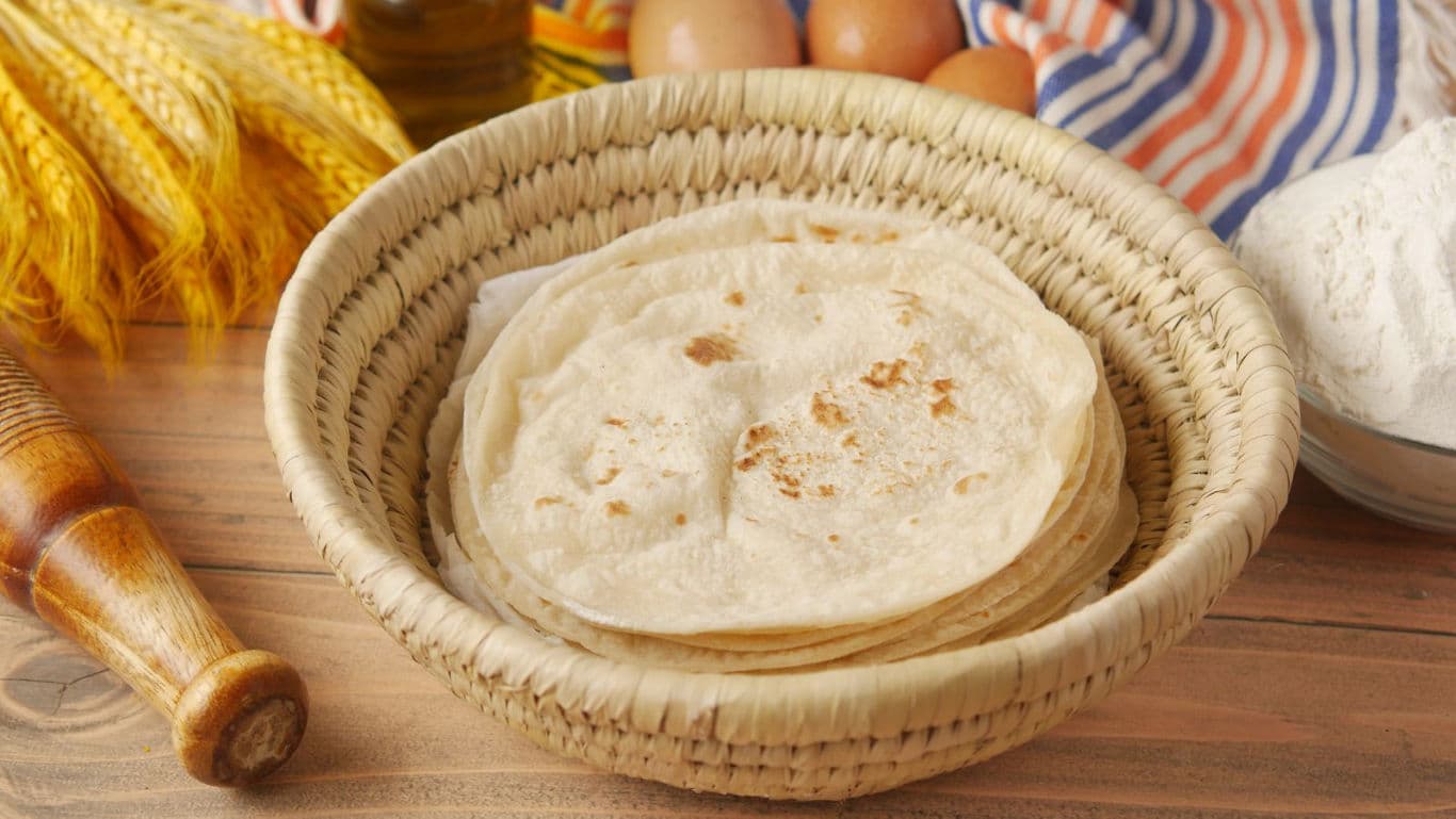 Fresh flatbreads in woven basket