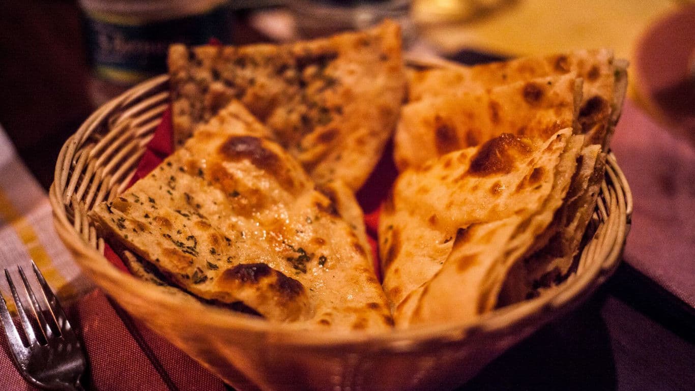 Basket of Assorted Flatbreads on Table