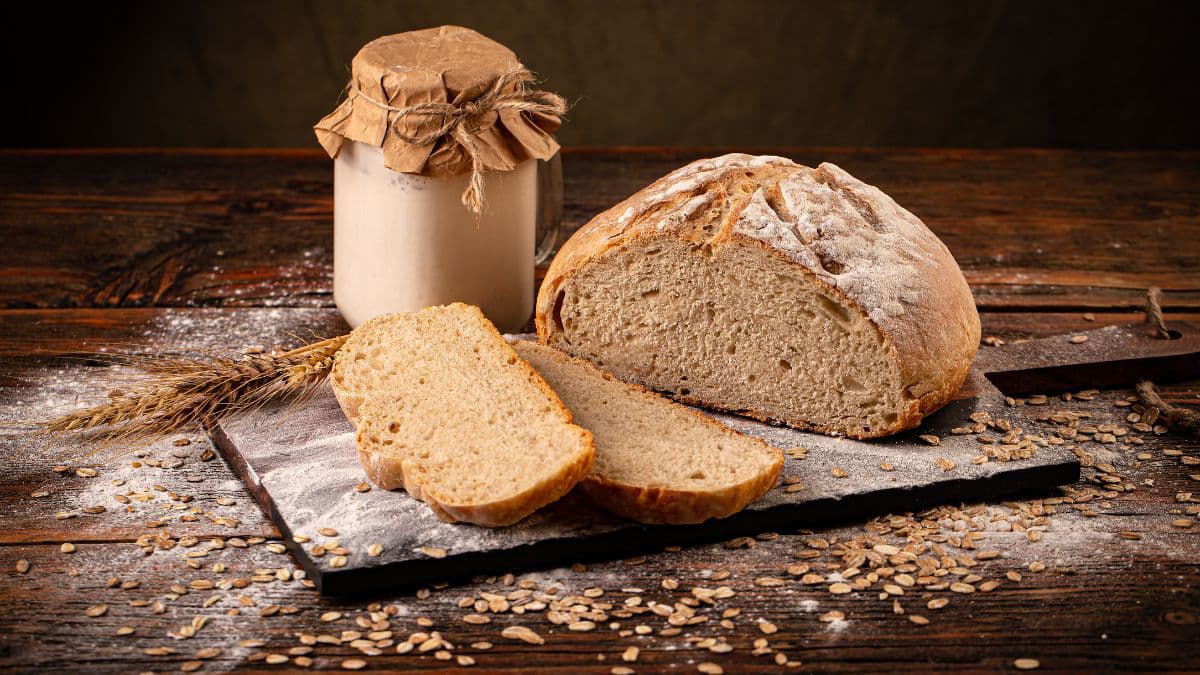 Sourdough bread with starter jar 