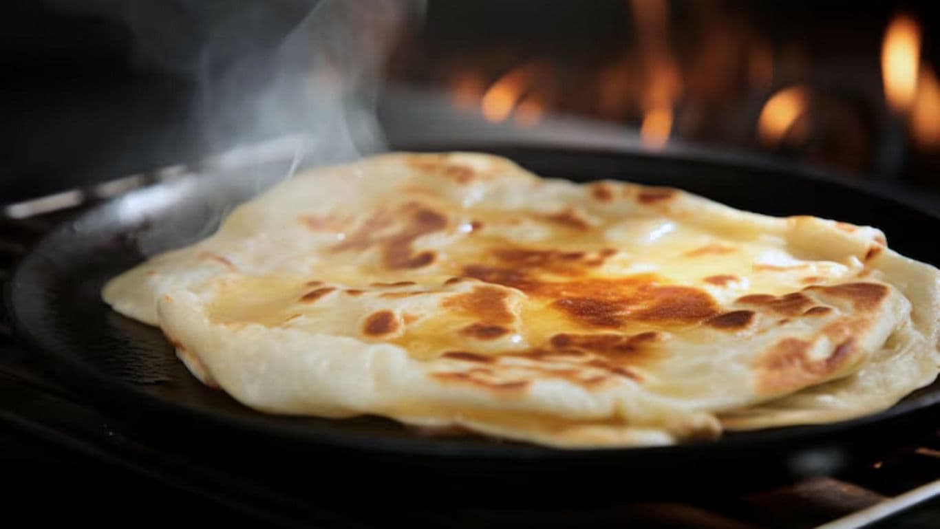 Golden Flatbread Cooking on Skillet