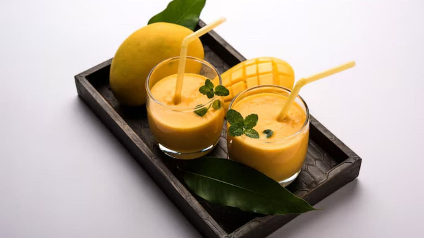 Fresh Mango Smoothie Glasses with Mint Garnish
