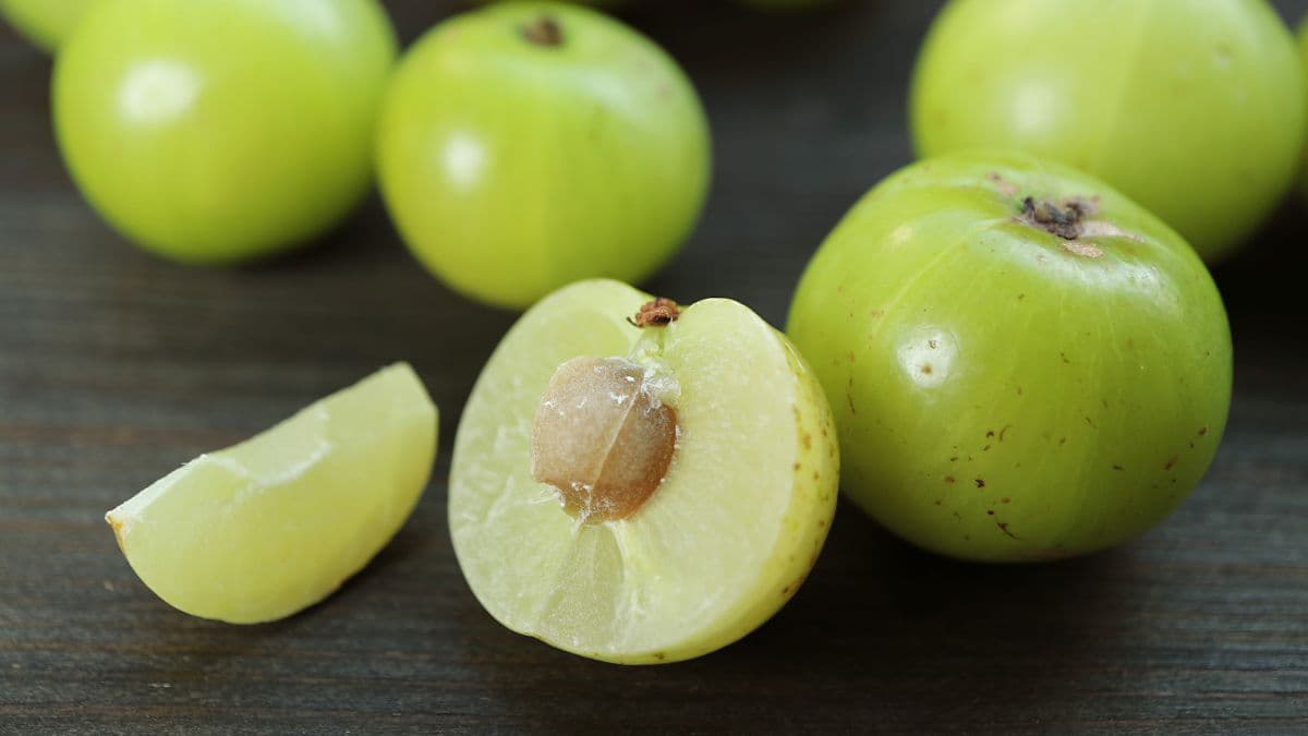 Cut amla with stone visible