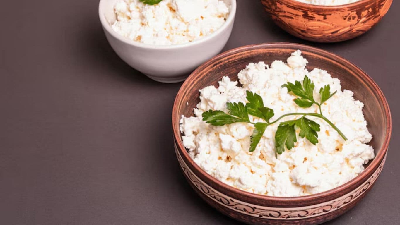 Fresh cottage cheese in ceramic bowls