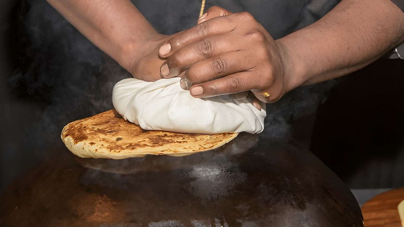 Traditional flatbread cooking on hot griddle
