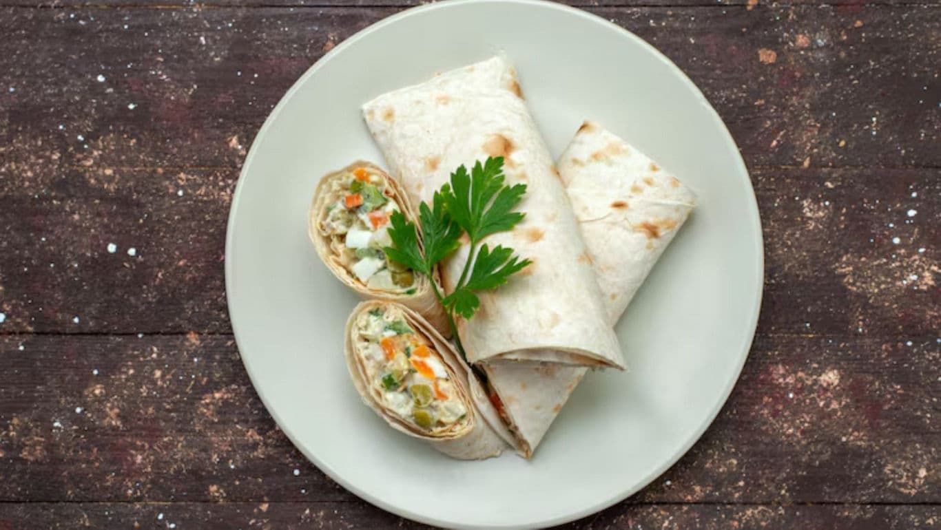 Fresh vegetable wraps on rustic plate