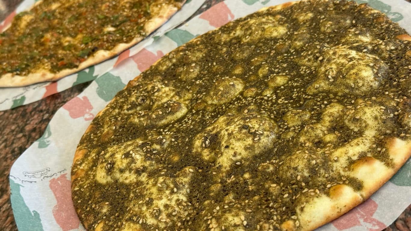 Freshly baked flatbreads topped with zaatar