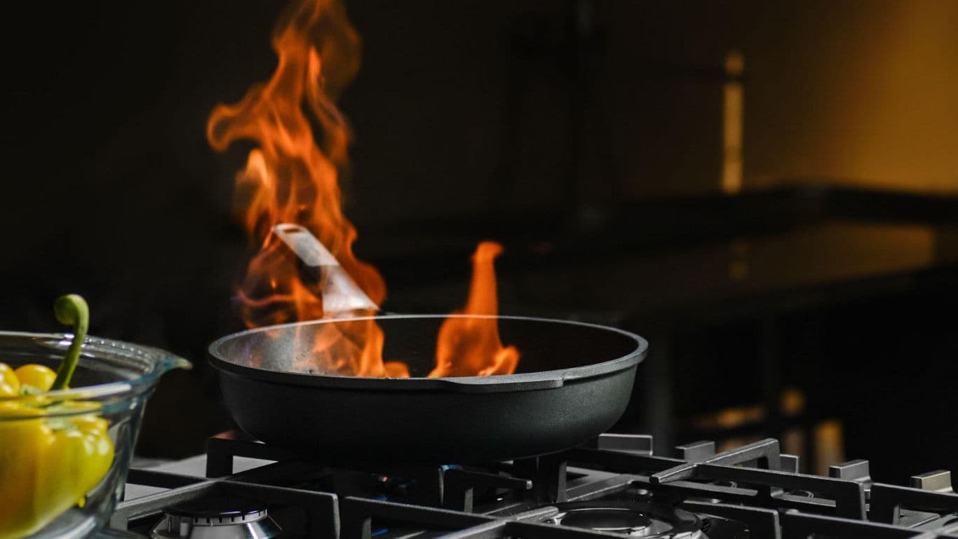 Flaming skillet on modern gas stove