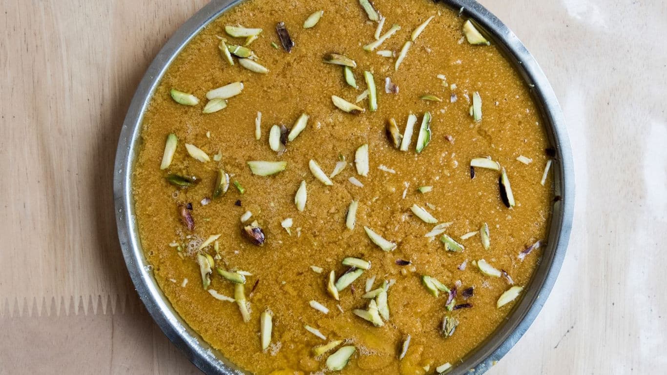 Traditional Indian dessert topped with nuts