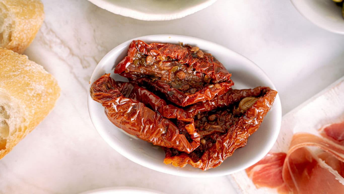 Sun-dried tomatoes served in white dish