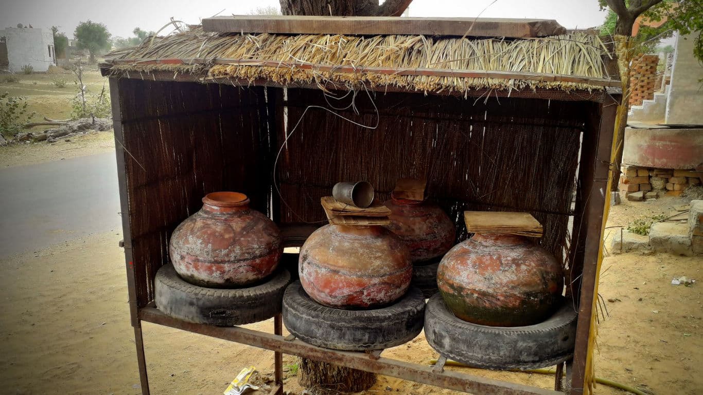 Traditional clay water pots in roadside shelter