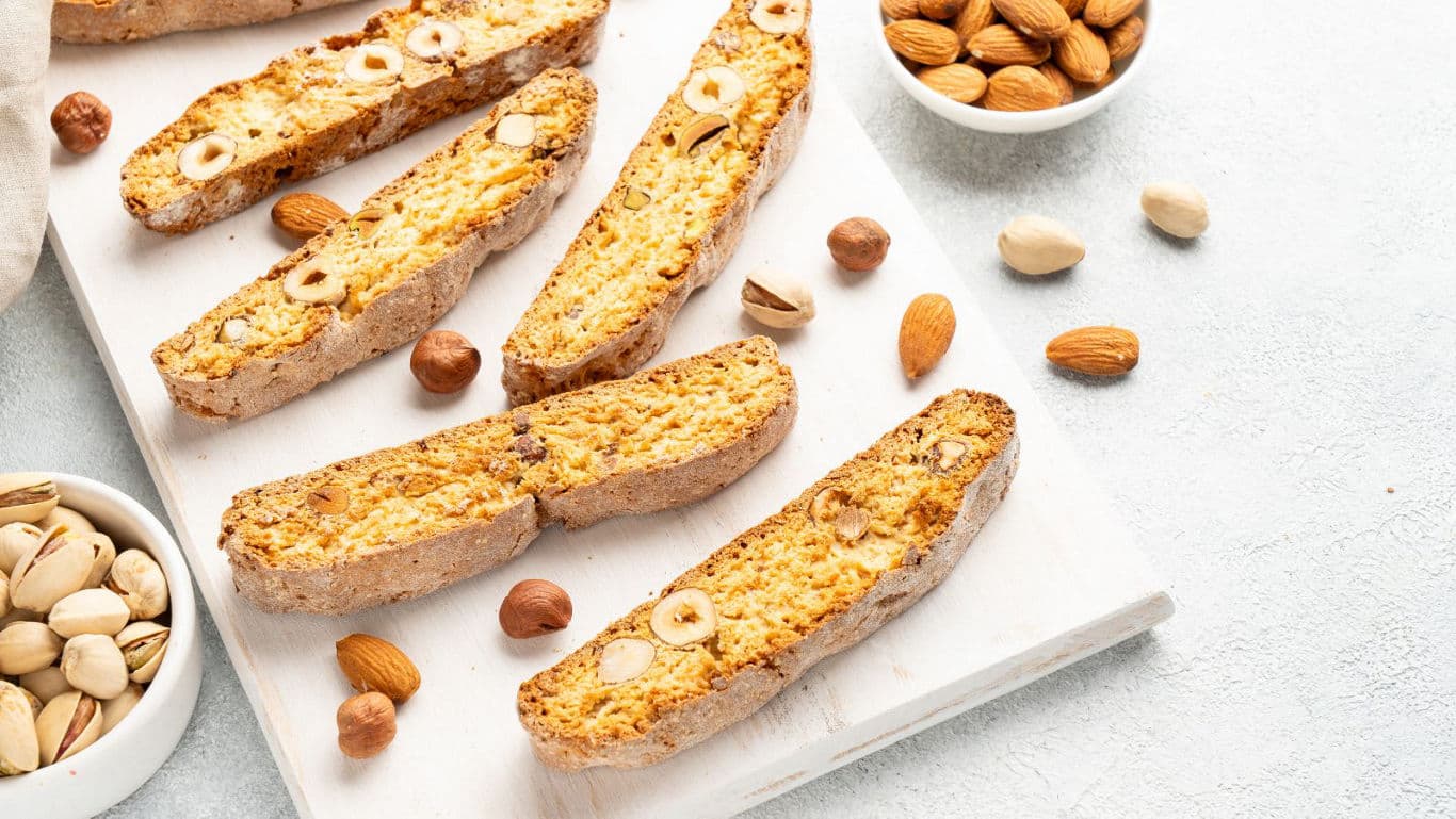 Almond hazelnut biscotti on white board