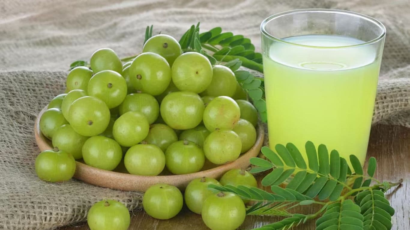 Fresh amla fruit with green juice