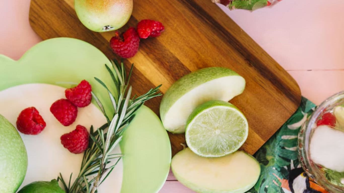 Fresh Fruit and Herb Arrangement on Wooden Board