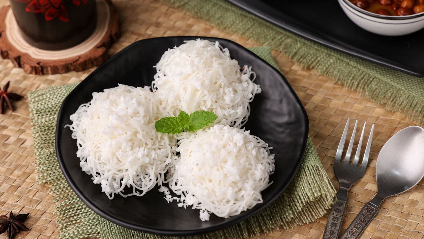 Traditional South Indian Idiyappam Served on Black Plate