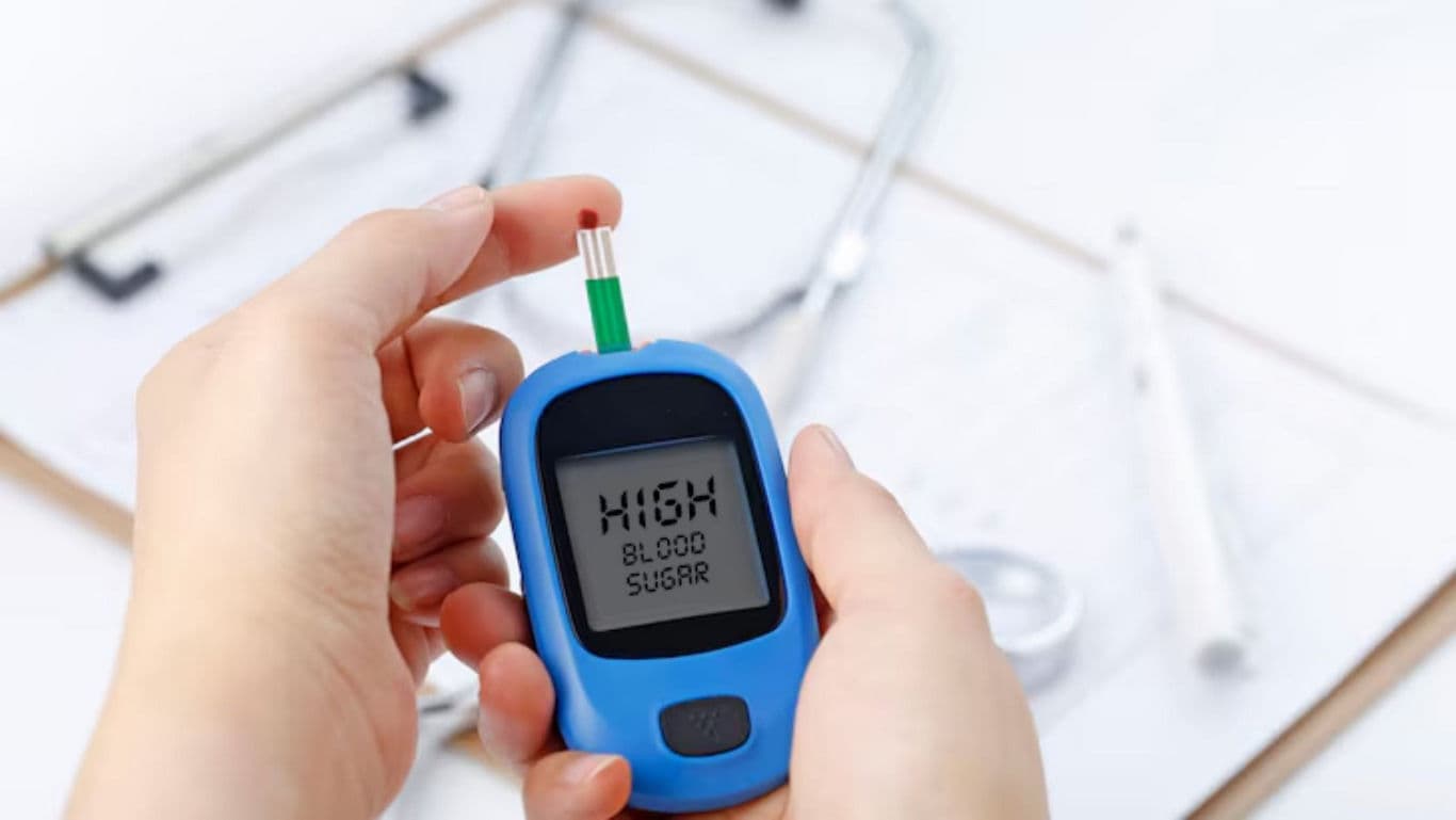 Person Checking Blood Sugar with Glucometer Device