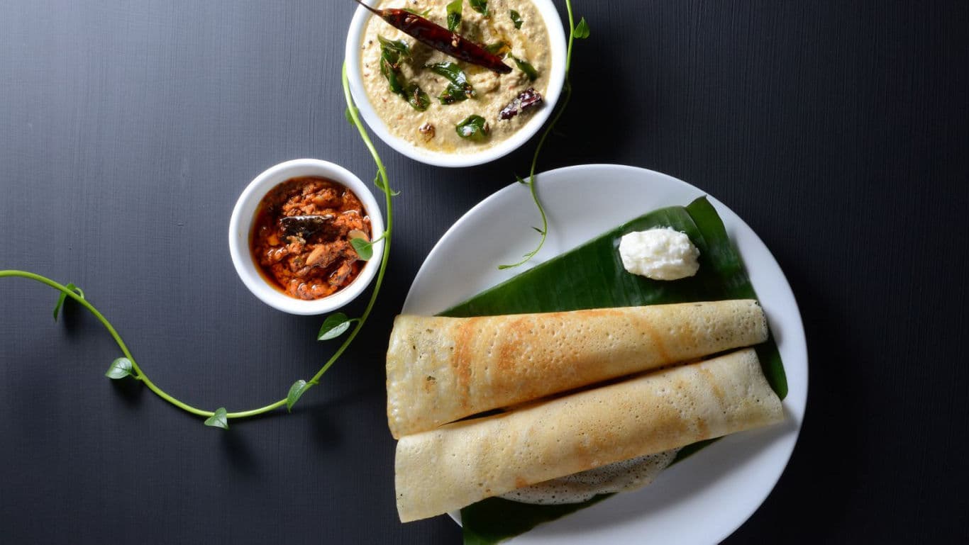 South Indian dosa with chutneys on plate