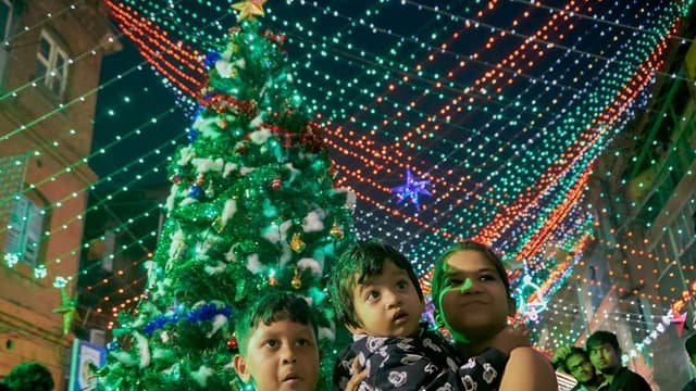  Kids watching Christmas lights.