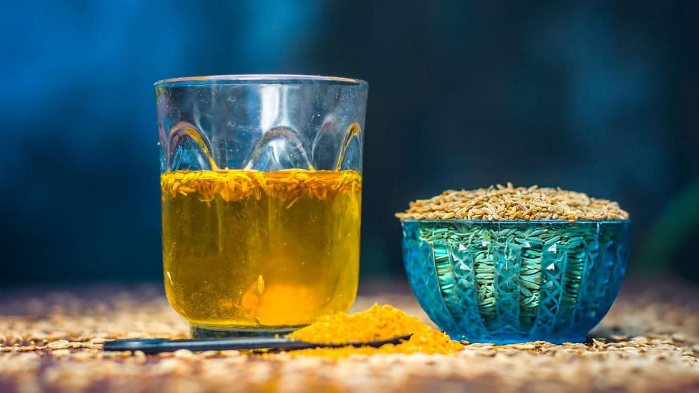 Glass of Herbal Tea with Cumin Seeds