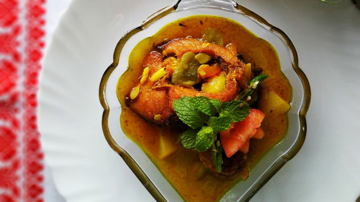 Spiced Fish Curry Garnished with Fresh Mint Leaves