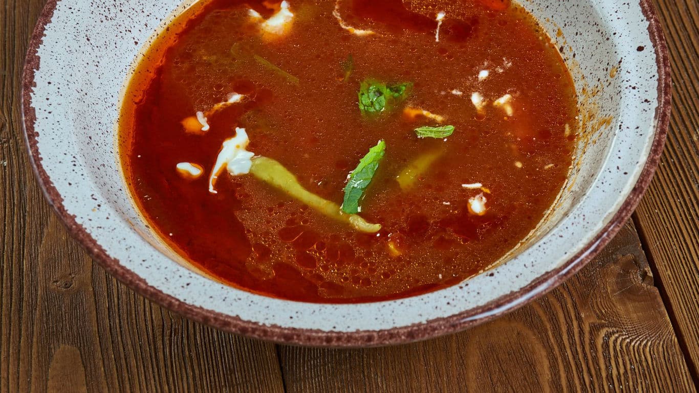 Rustic bowl of spicy red soup