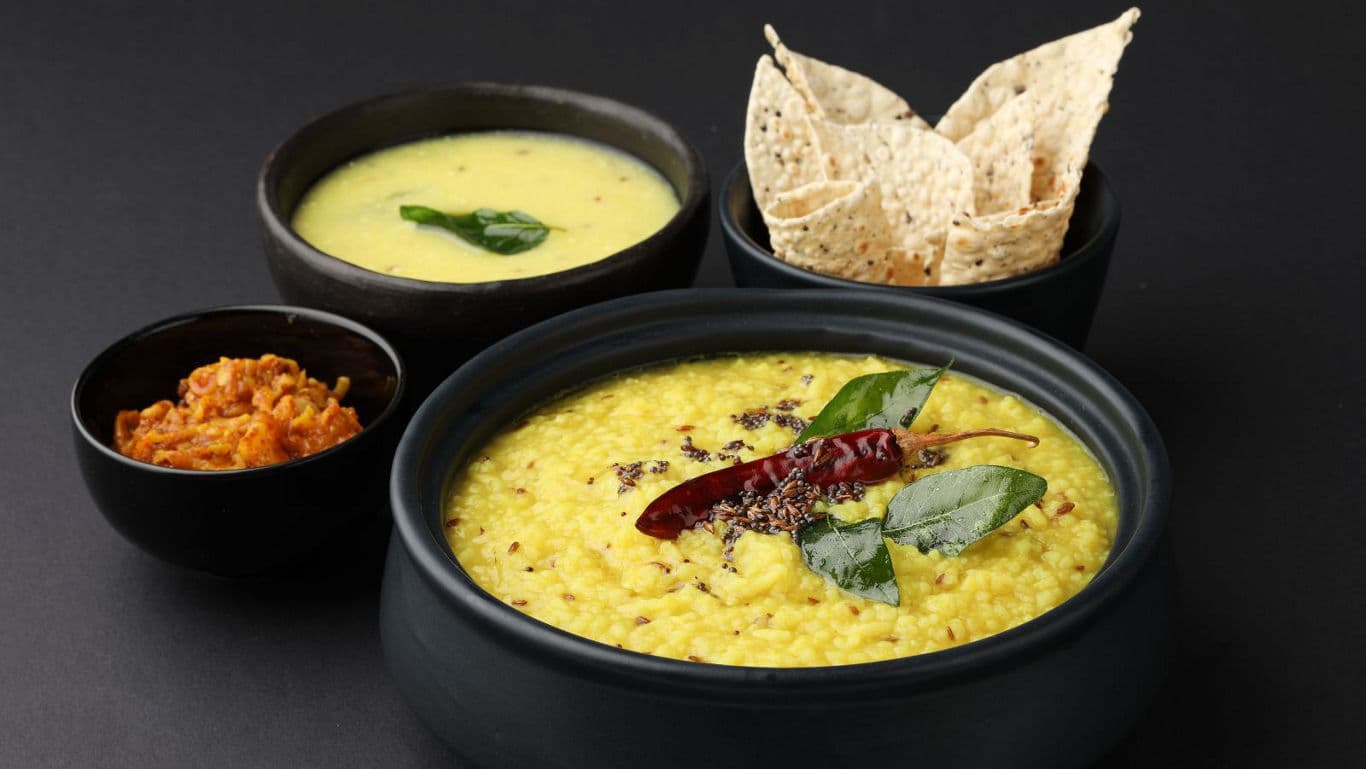 Kairichi Dal with papad and kadhi.