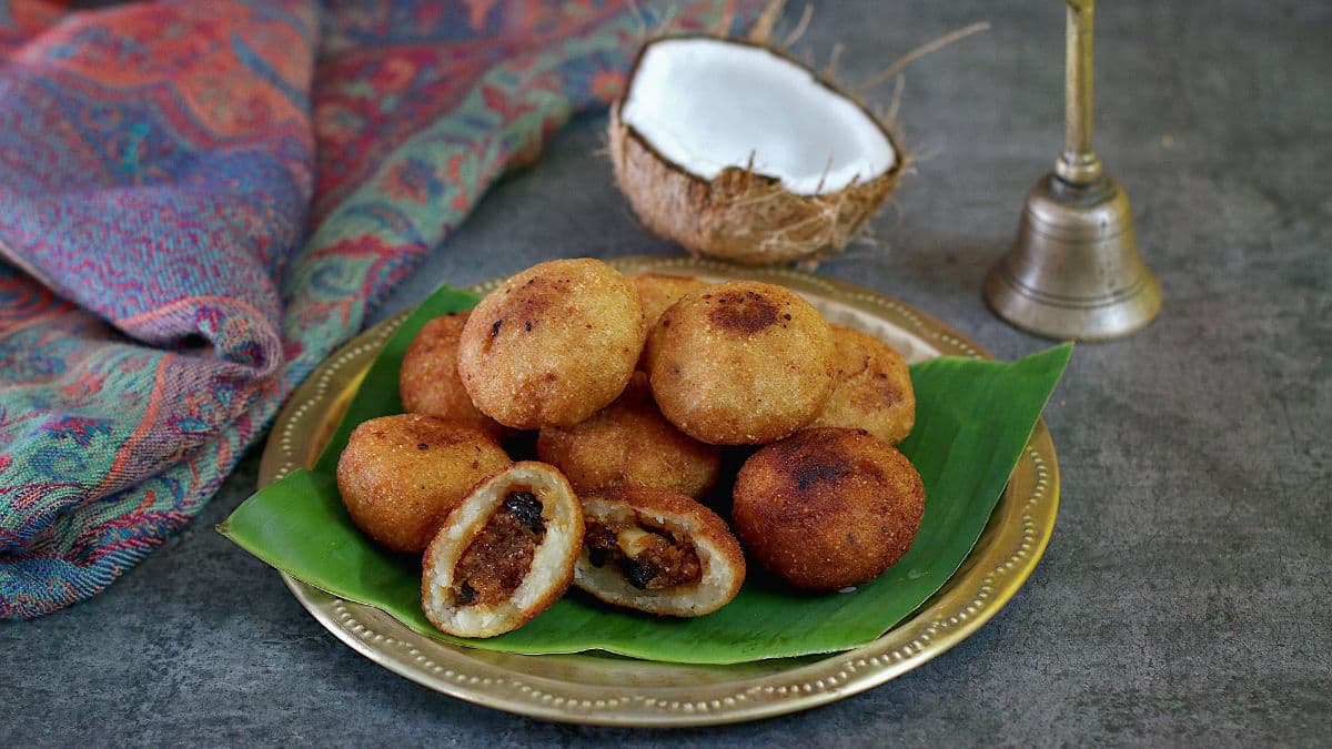 Kakara pitha on a plate with banana leaf