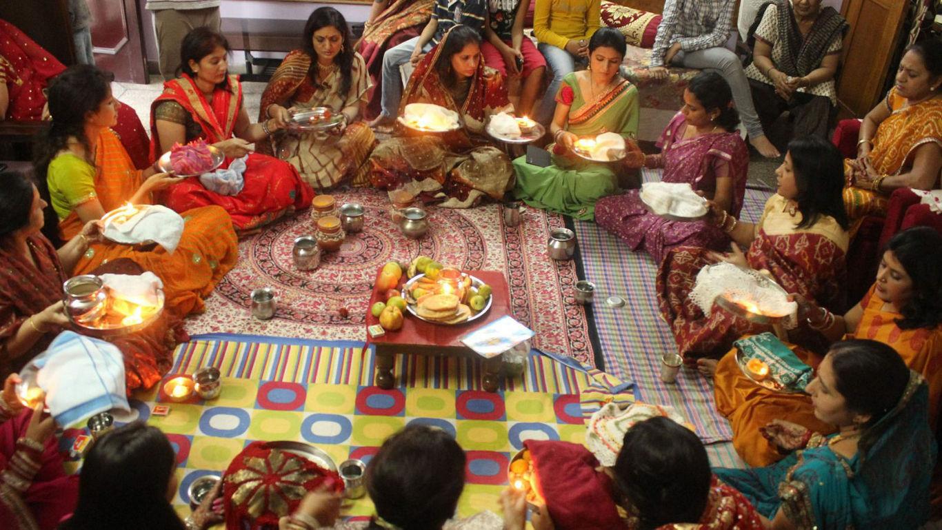 Women in traditional attire during ritual