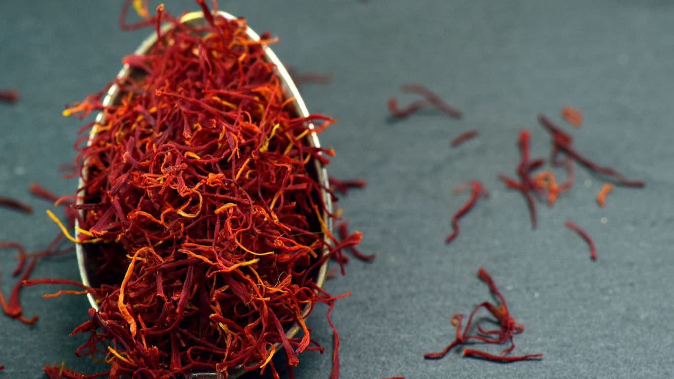 Close-up of Saffron Threads on Dark Surface