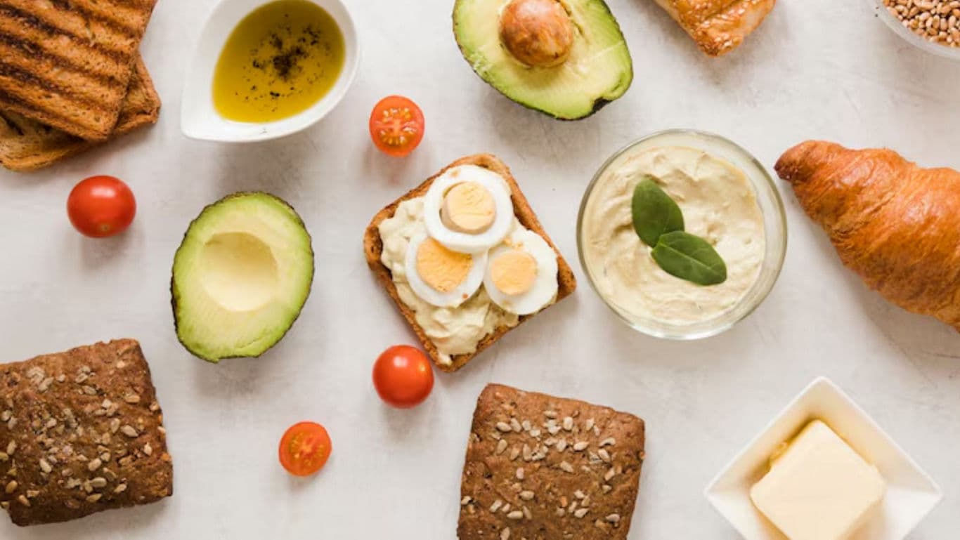 Healthy breakfast spread with avocado and eggs