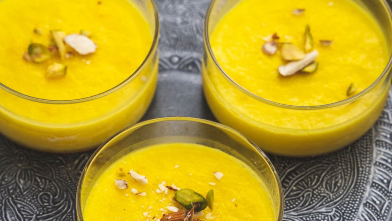 Three bowls of saffron pistachio dessert