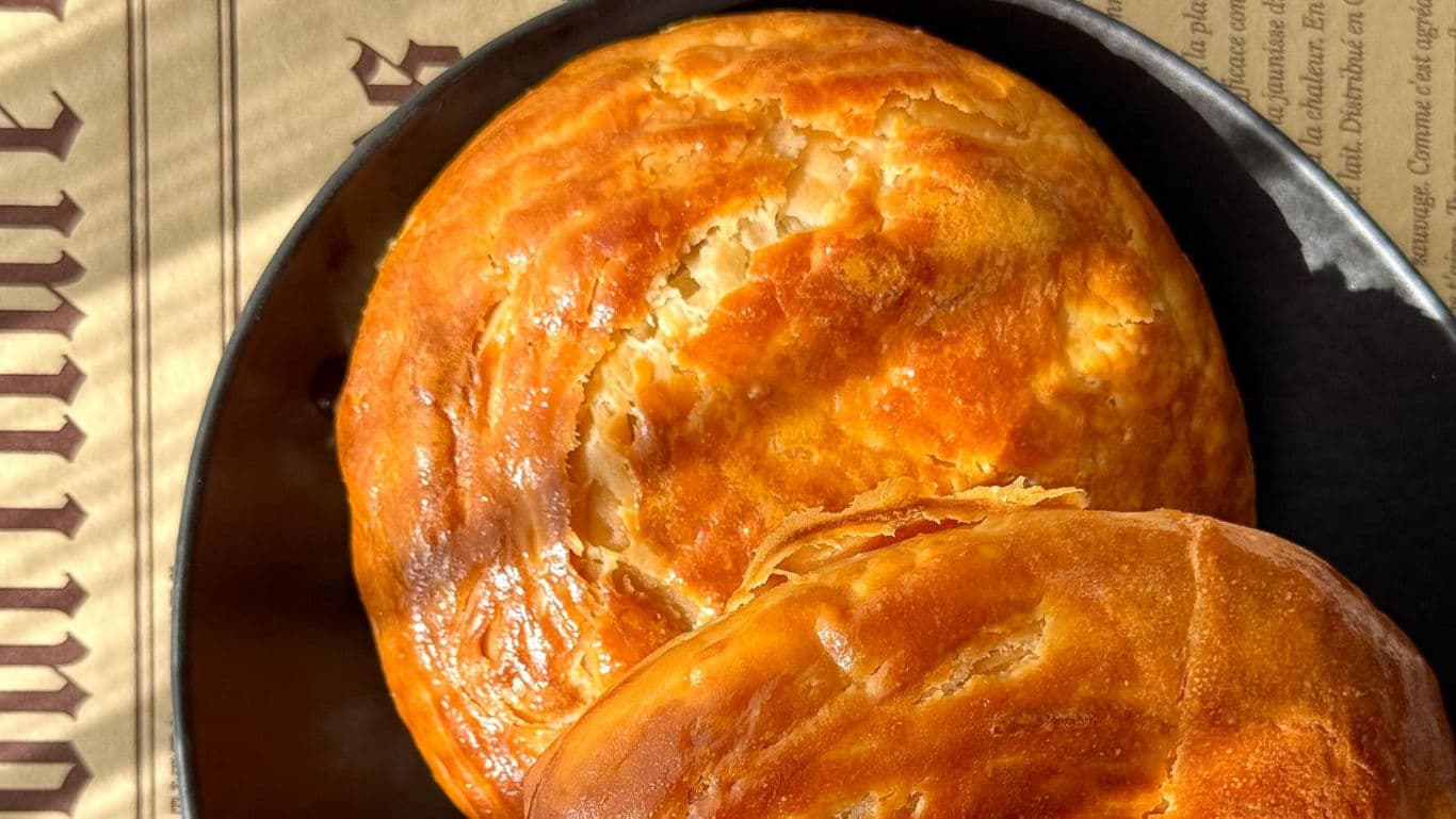 Golden round bread rolls in sunlight