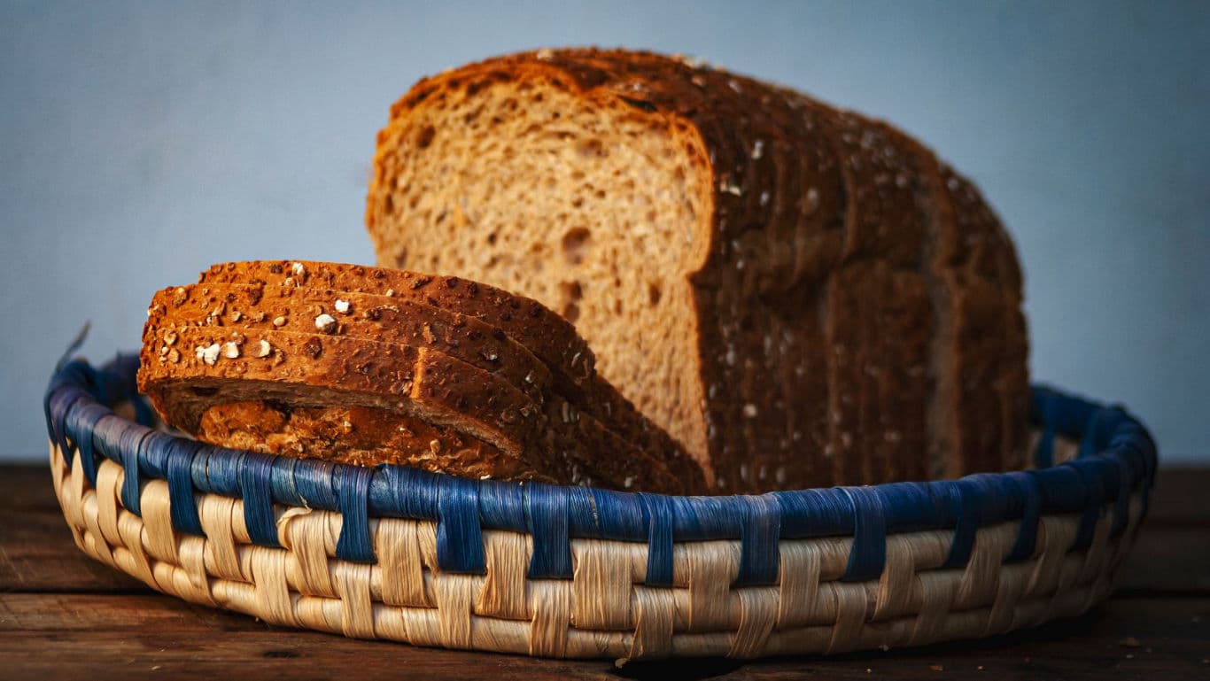 Sliced multigrain bread in woven basket