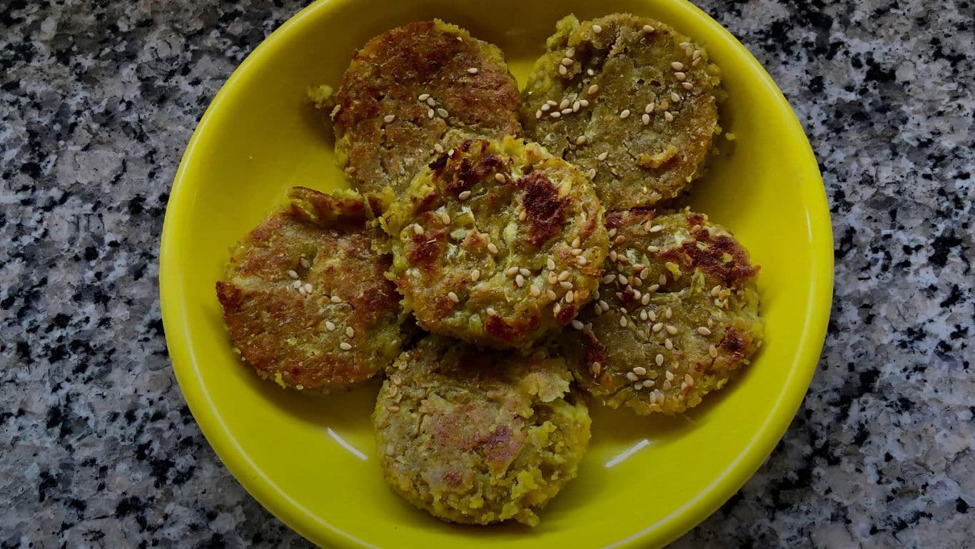 Homemade savory patties on yellow plate