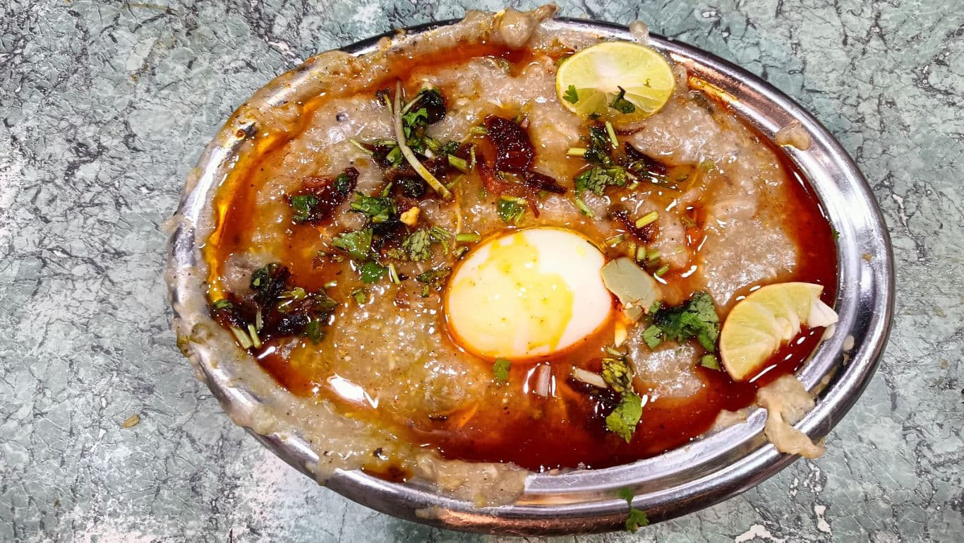 Spiced meat porridge with boiled egg