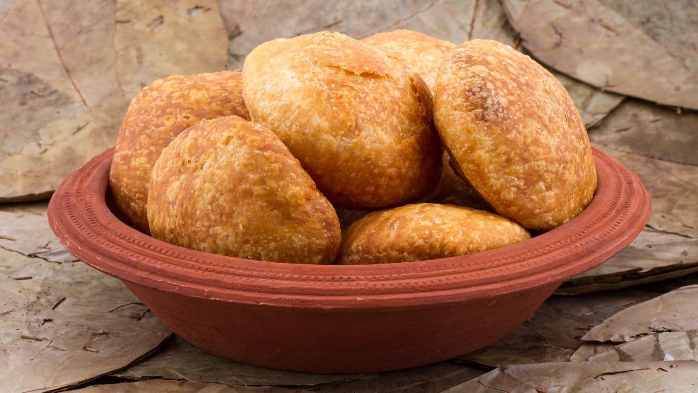 Traditional fried pastries in clay bowl