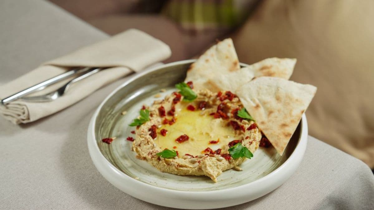 pita around a hummus bowl