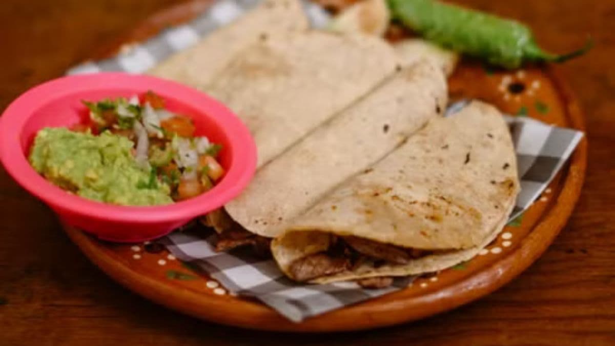 traditional tacos on a brown plate