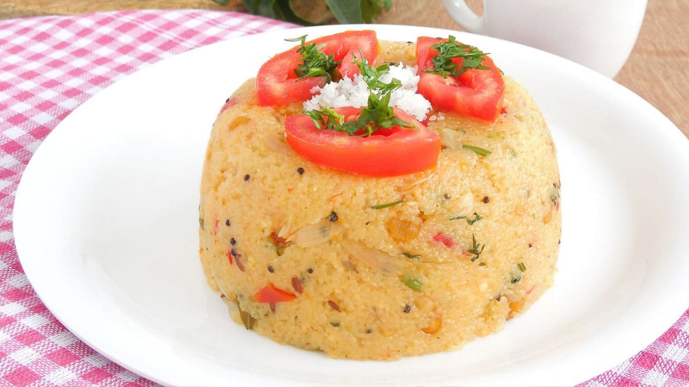 Savory semolina dish garnished with tomato slices