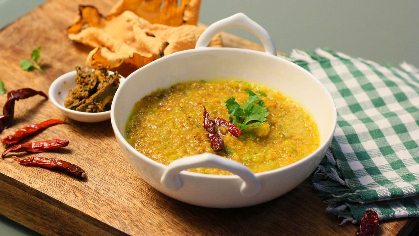 Bowl of lentil curry with sides