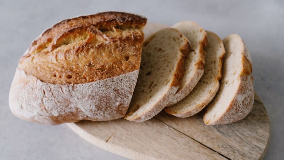Bread on a chopping board with slices